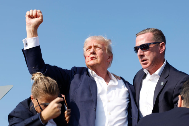 President Trump fist pumping the crowd after being shot in the head